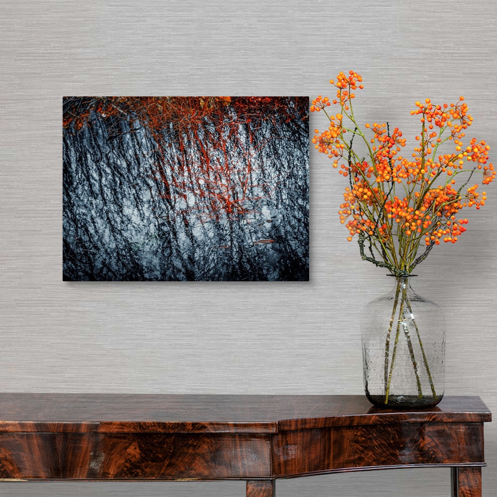 A traditional room featuring Abstract photograph with rough textures in black, red, and white.
