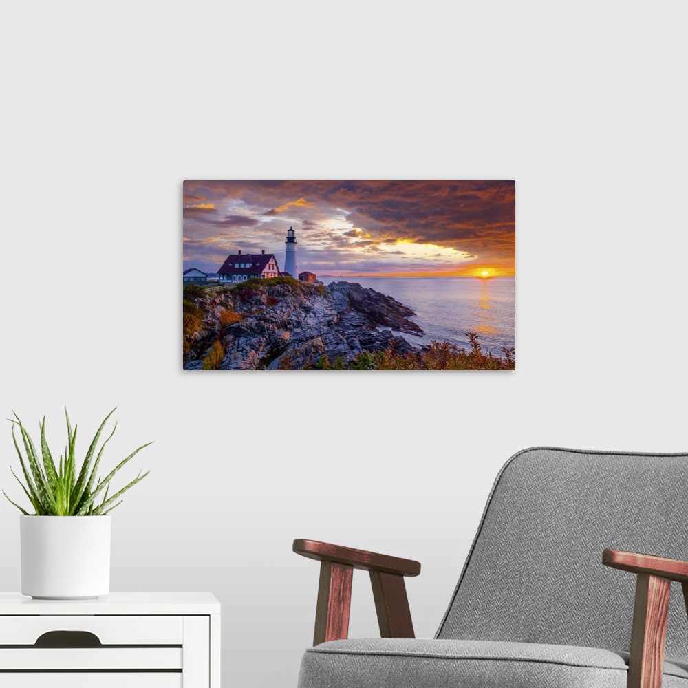 A modern room featuring Portland Head Light is a historic lighthouse in Cape Elizabeth, Maine. A wonderful sunrise with i...