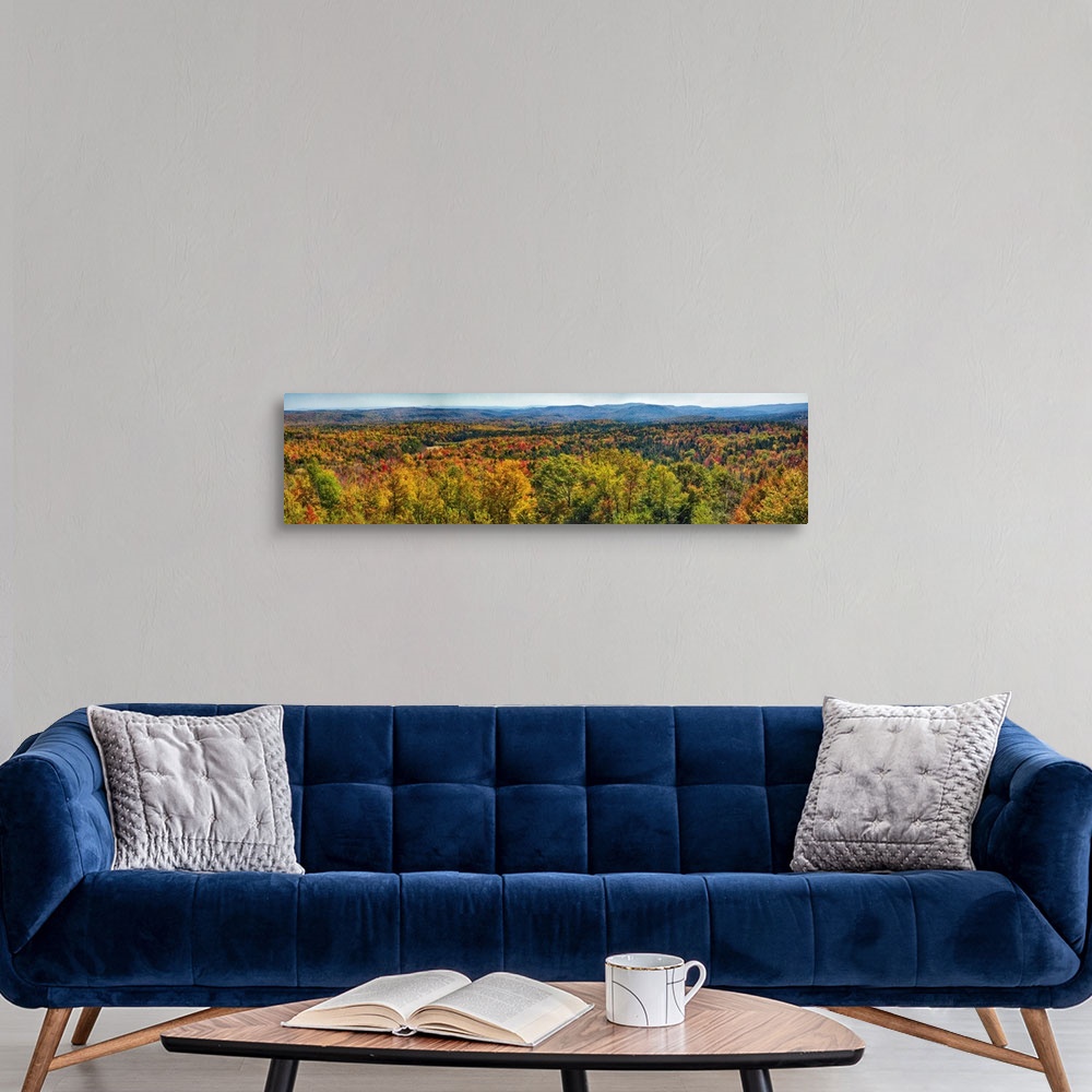 A modern room featuring Panoramic view of a virtually endless forest turning autumn colors in New England.