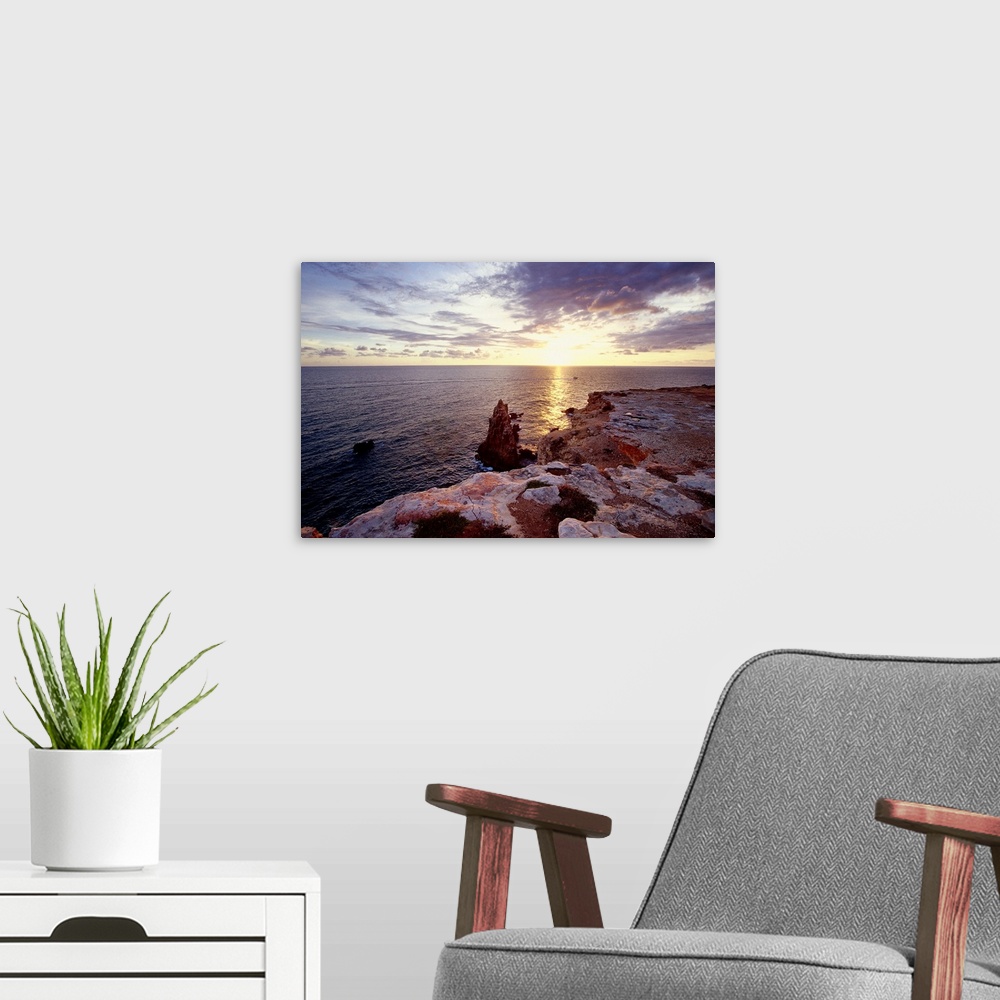A modern room featuring Sunset Over Cabo Rojo, Puerto Rico