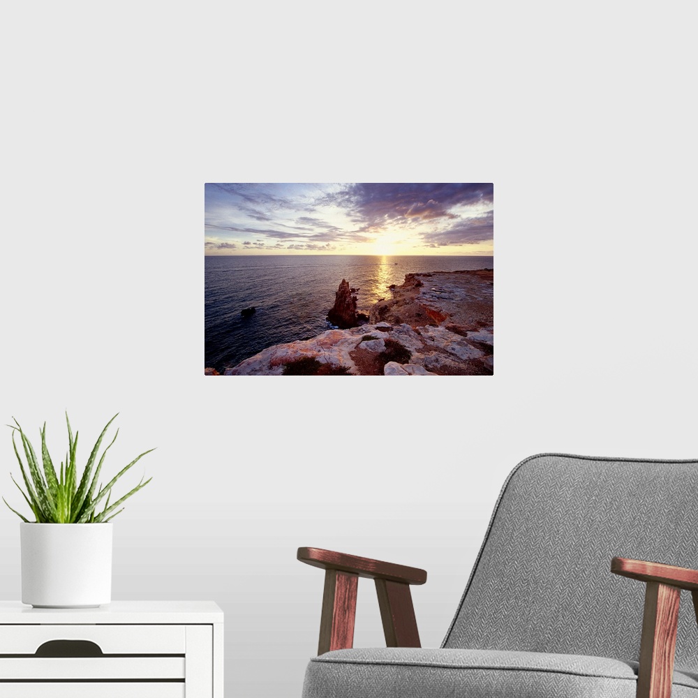 A modern room featuring Sunset Over Cabo Rojo, Puerto Rico