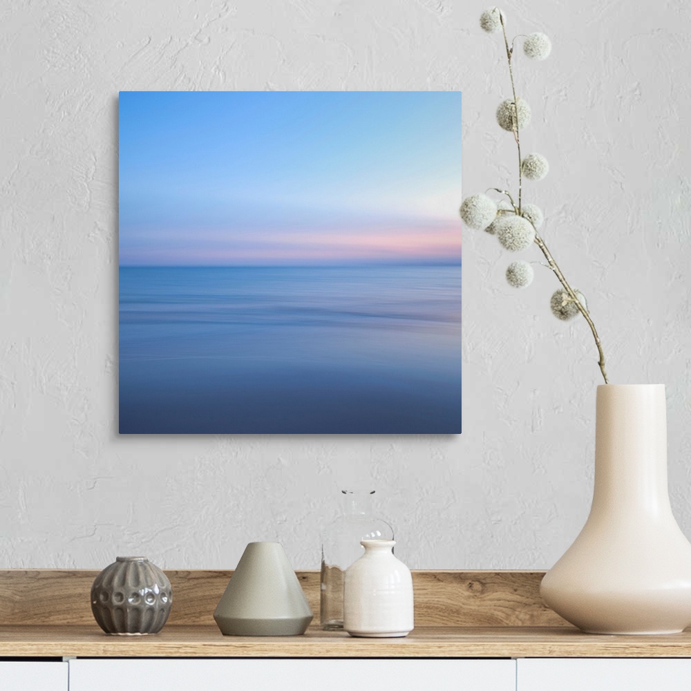 A farmhouse room featuring The ocean and sky in this picture are barely different shades and almost blend together.