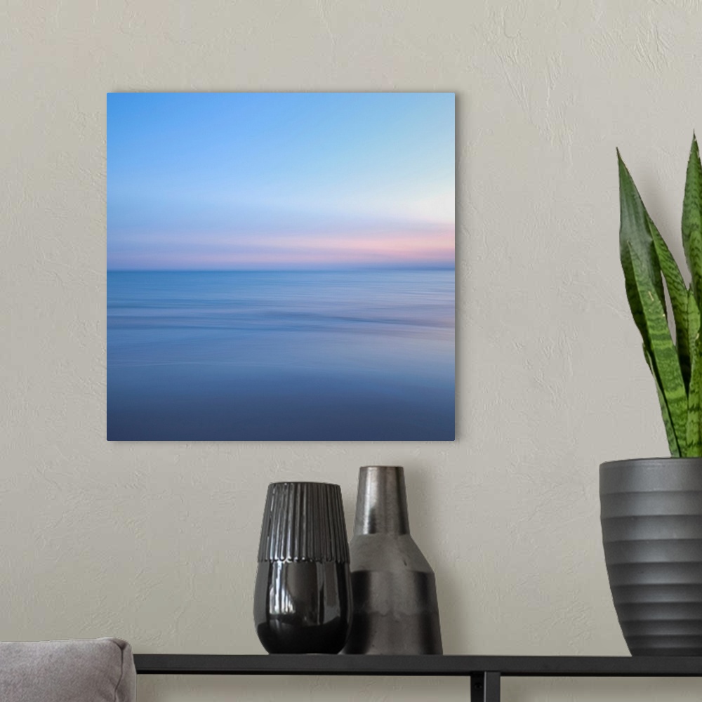A modern room featuring The ocean and sky in this picture are barely different shades and almost blend together.