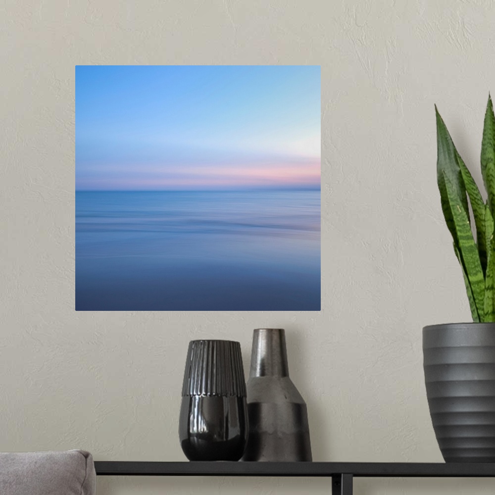 A modern room featuring The ocean and sky in this picture are barely different shades and almost blend together.