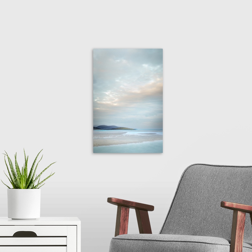 A modern room featuring Light blue summer skies over islands and teal water.
