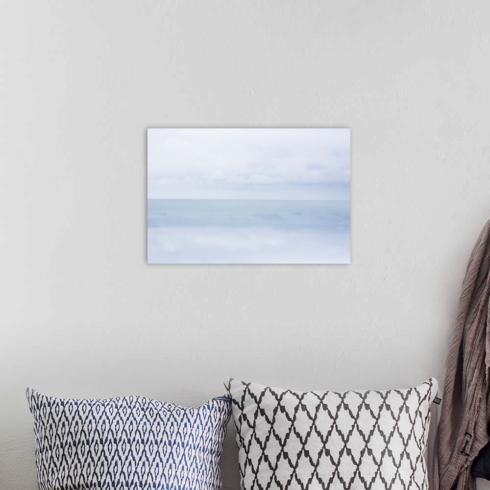 A bohemian room featuring A photograph of a cold and frigid seascape.