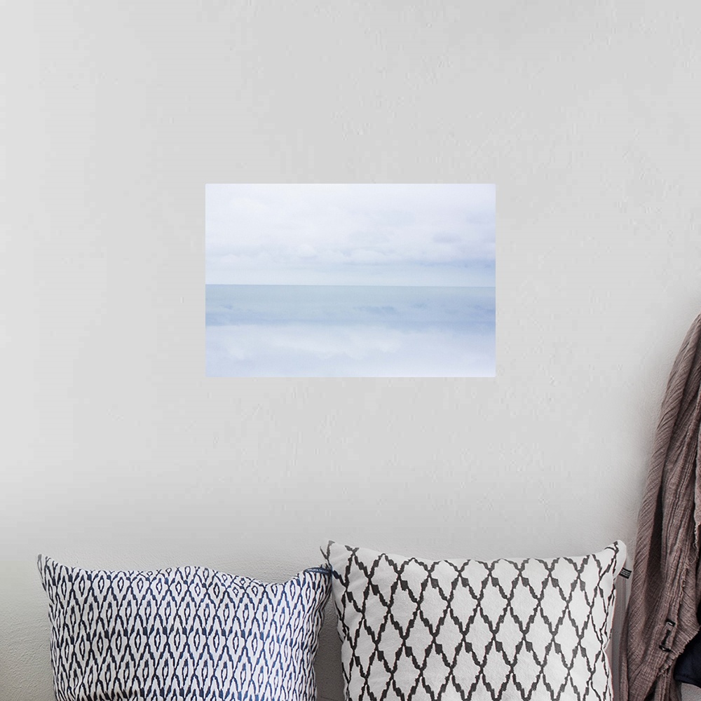 A bohemian room featuring A photograph of a cold and frigid seascape.