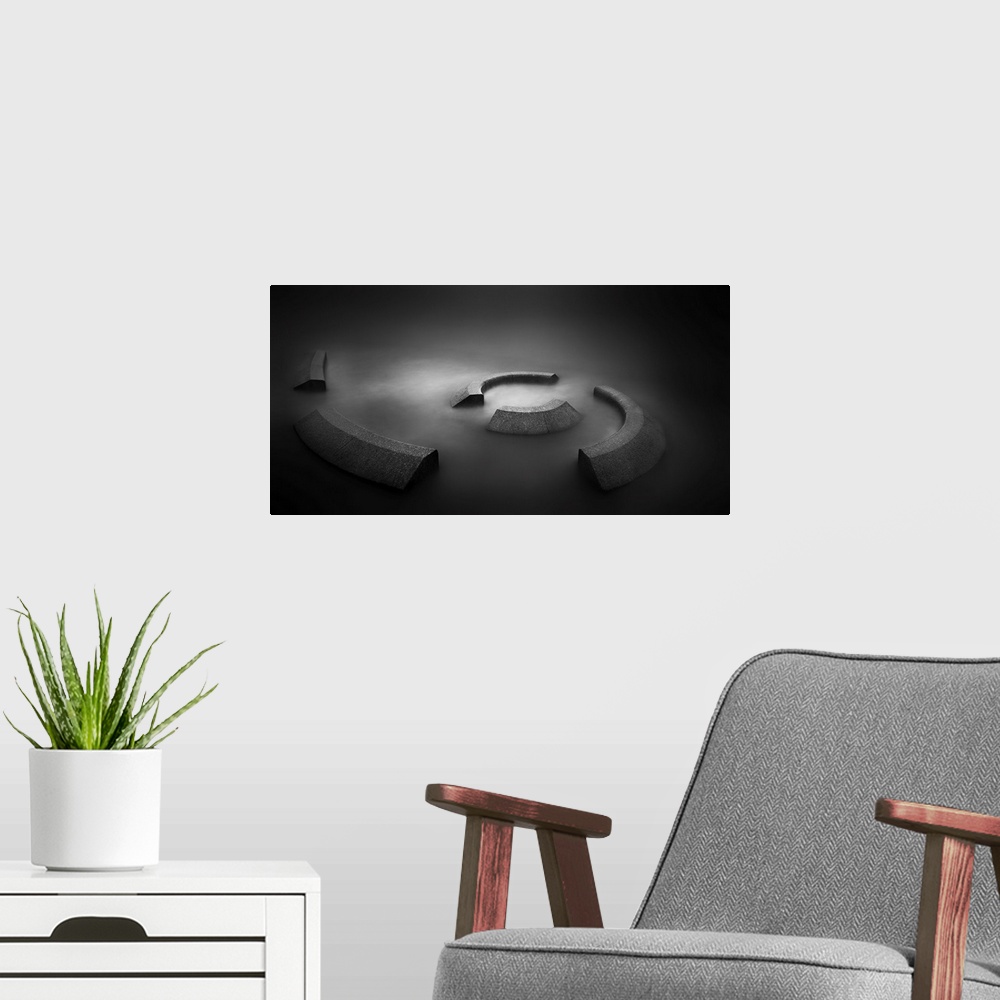 A modern room featuring A contemporary dramatic monochrome black and white intense image of a spiral concrete installatio...