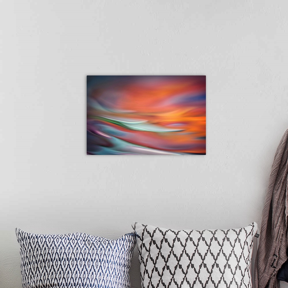 A bohemian room featuring Abstract photo of smooth waves in warm, fiery tones.