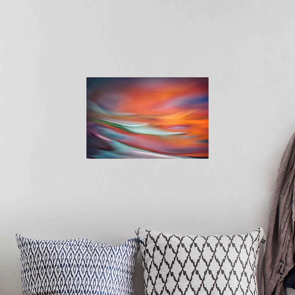 A bohemian room featuring Abstract photo of smooth waves in warm, fiery tones.