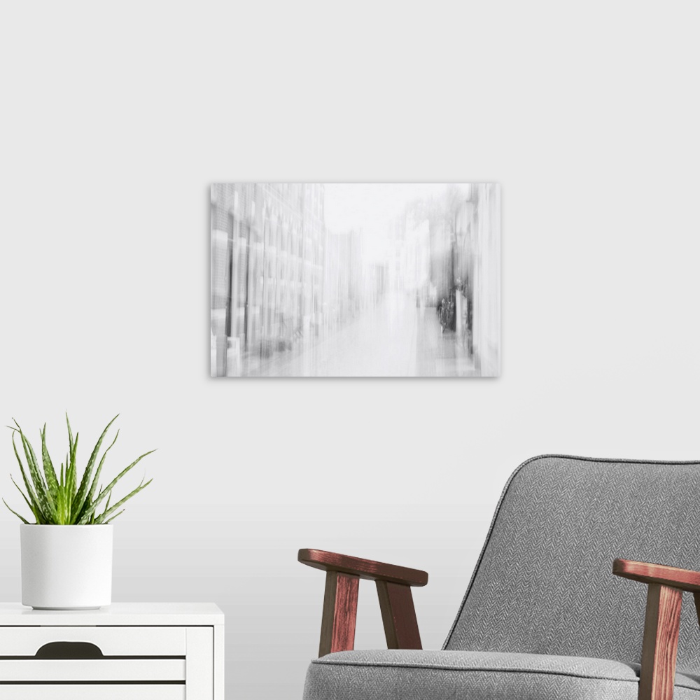 A modern room featuring Artistically blurred photo. Faint memories of the past accompany you when you walk through a stre...