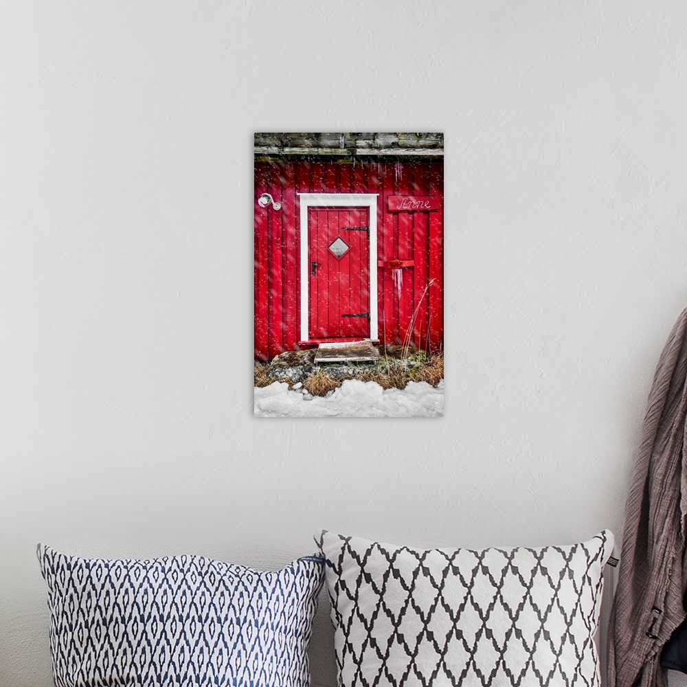 A bohemian room featuring Door of a red chalet in Norway, also called rorbu