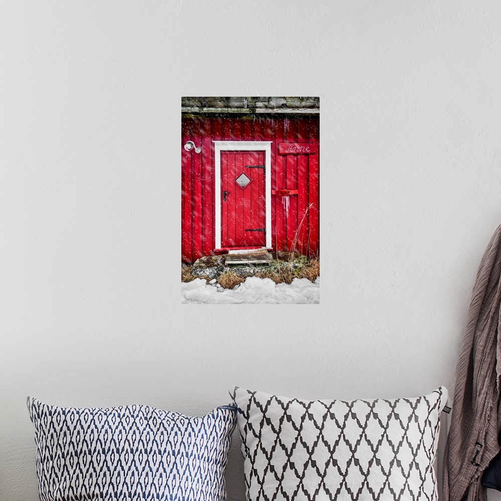 A bohemian room featuring Door of a red chalet in Norway, also called rorbu