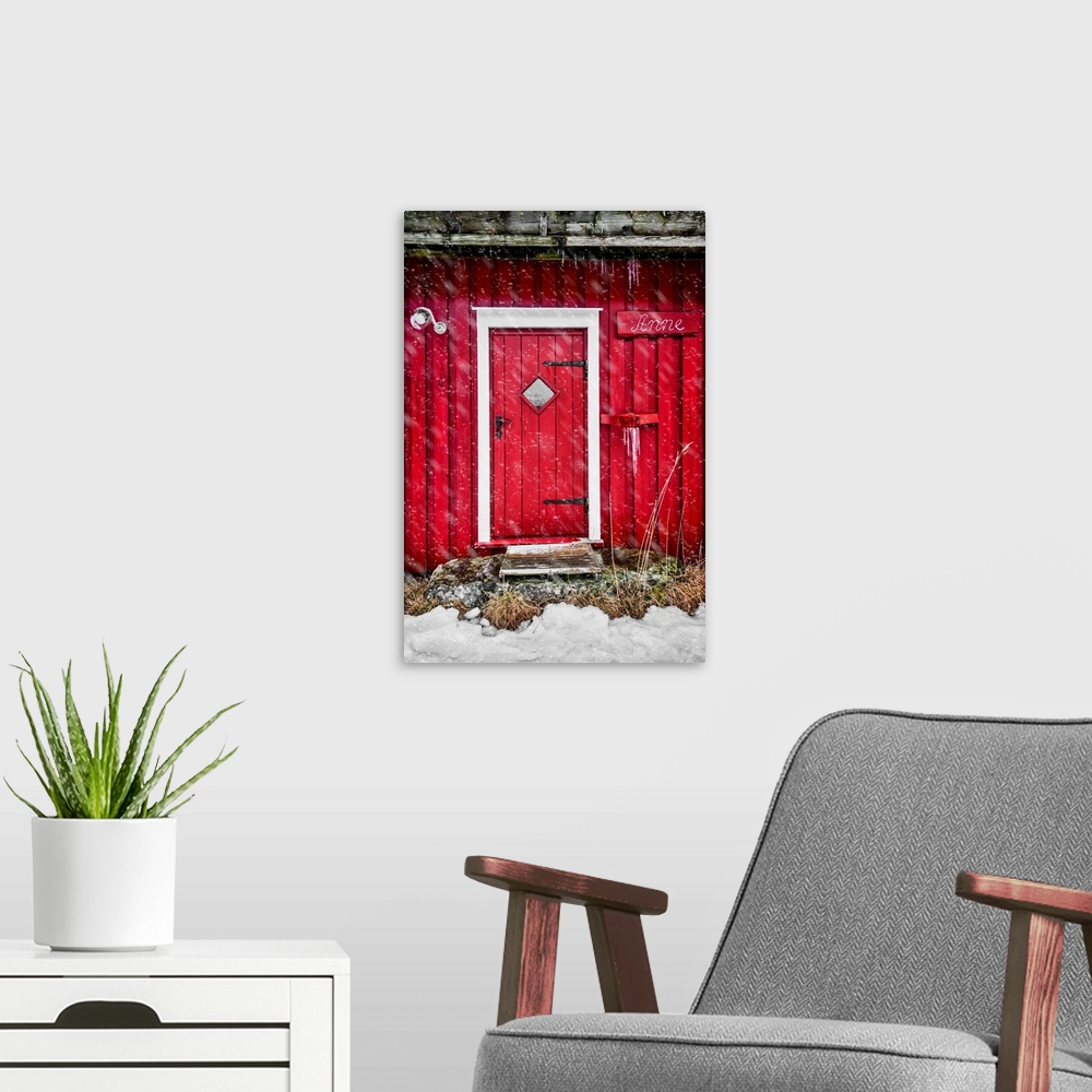 A modern room featuring Door of a red chalet in Norway, also called rorbu