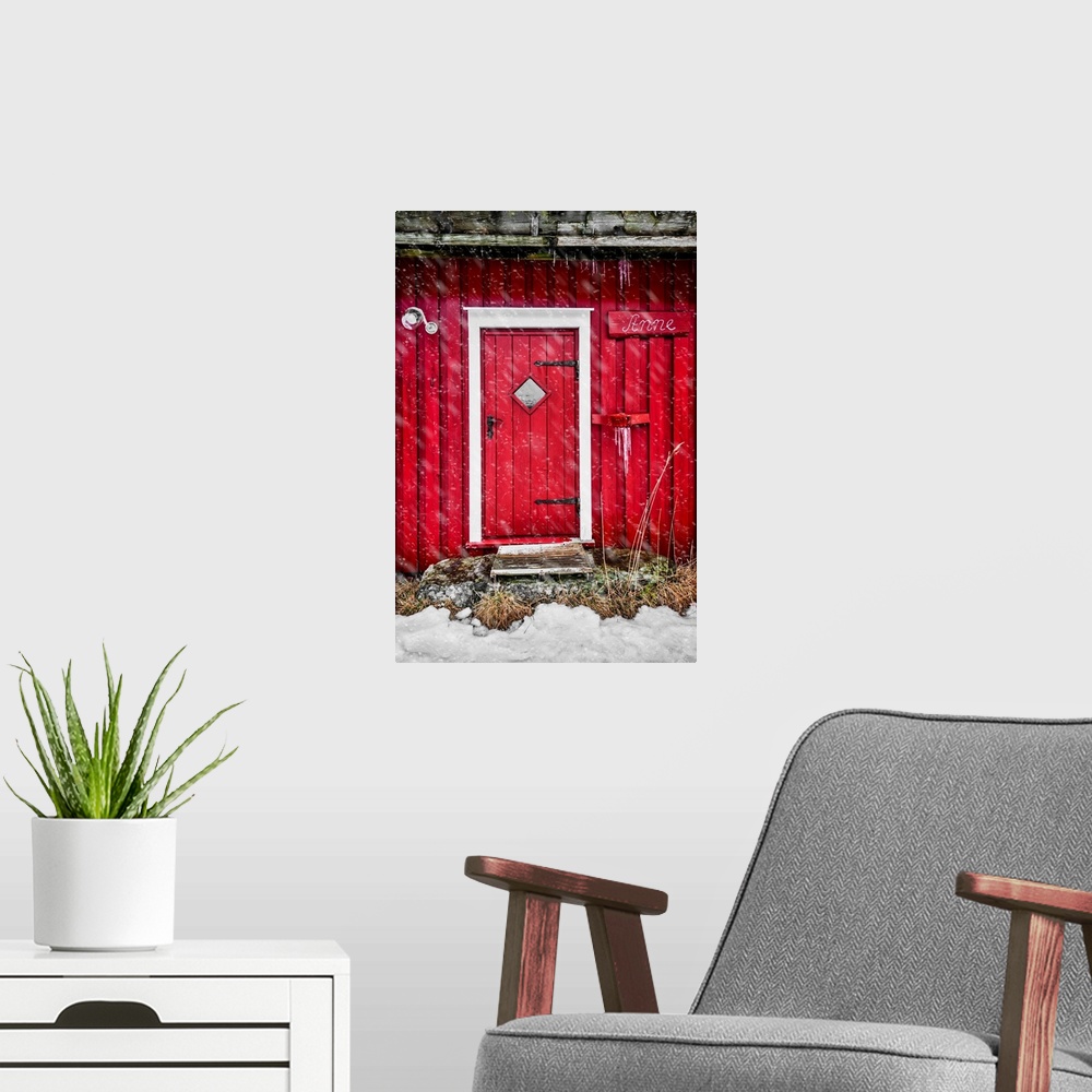 A modern room featuring Door of a red chalet in Norway, also called rorbu