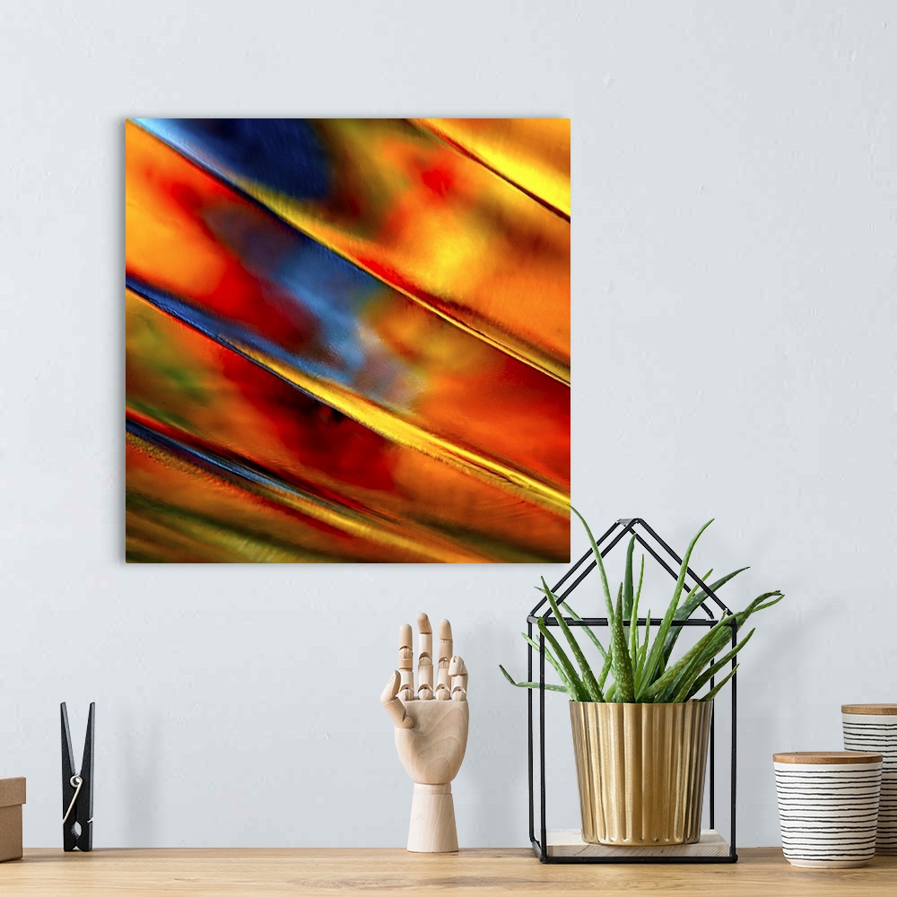 A bohemian room featuring Abstract photograph of orange ridges against red and blue.