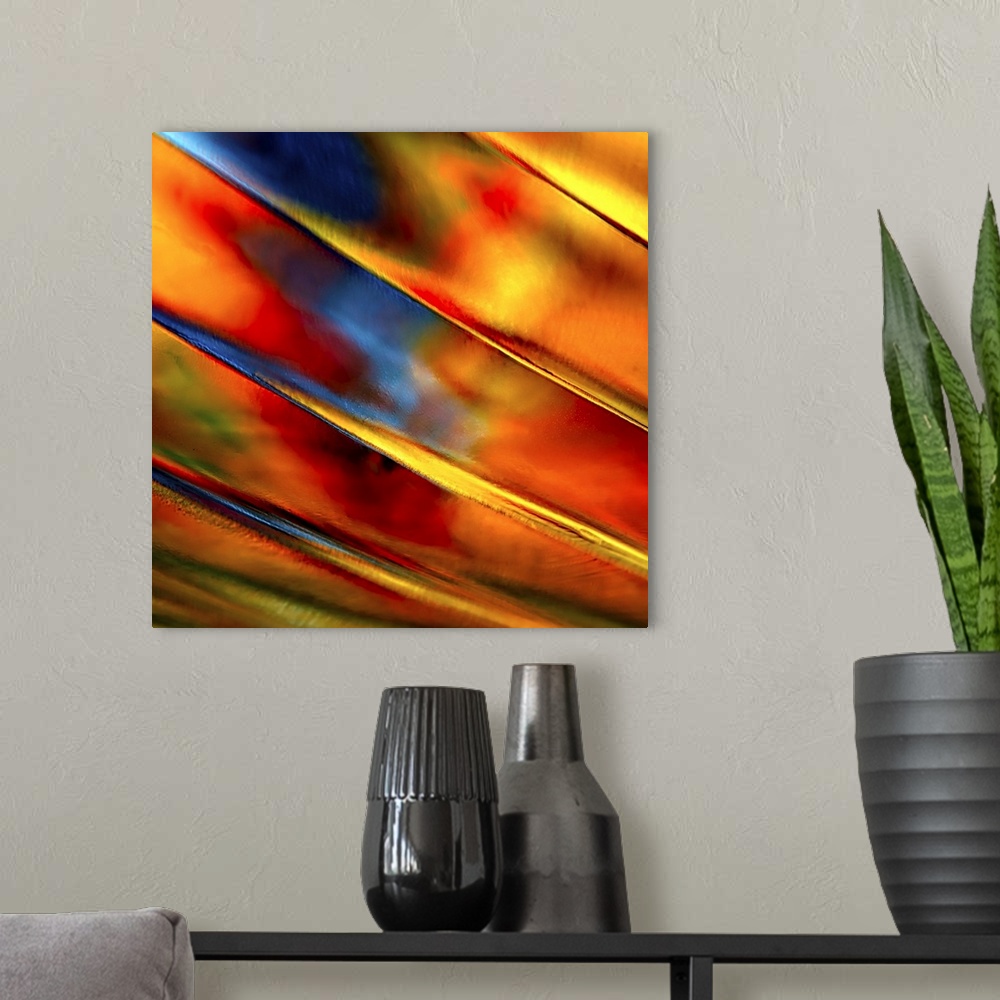 A modern room featuring Abstract photograph of orange ridges against red and blue.