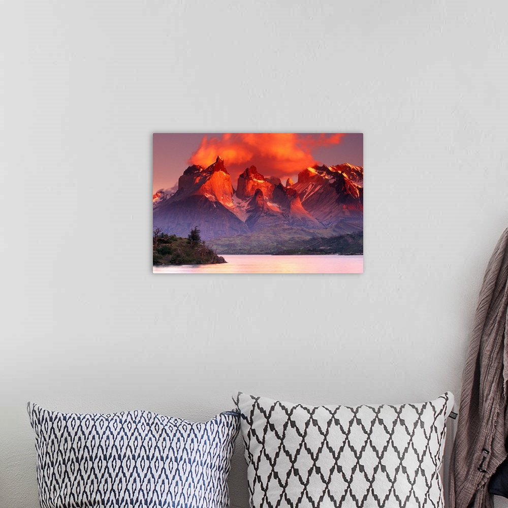 A bohemian room featuring This breathtaking view is of immense mountains that have warm tones at the very top from the suns...