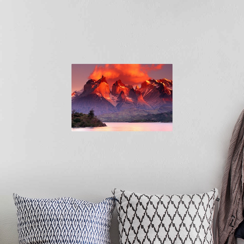 A bohemian room featuring This breathtaking view is of immense mountains that have warm tones at the very top from the suns...