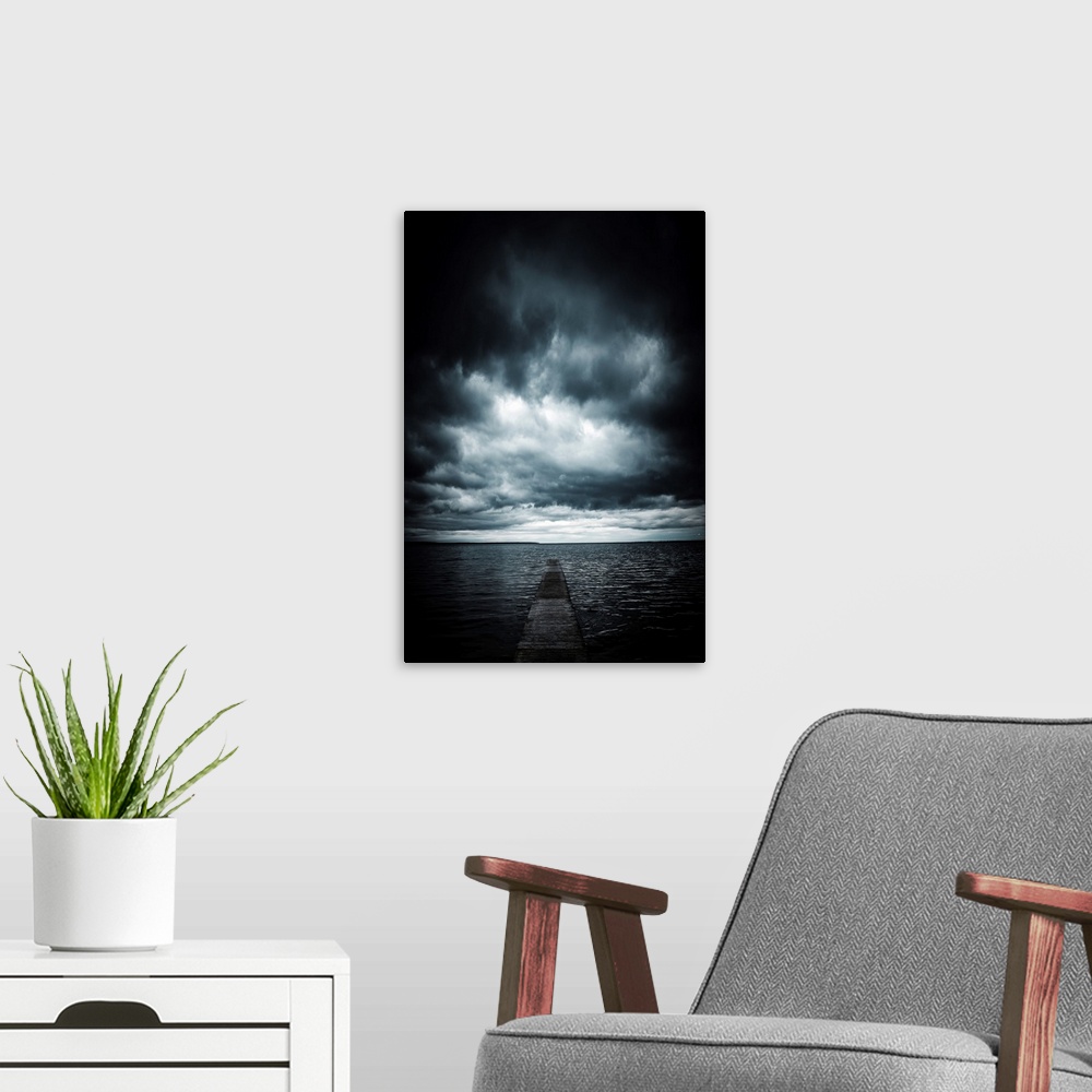 A modern room featuring Stormy sky over the sea