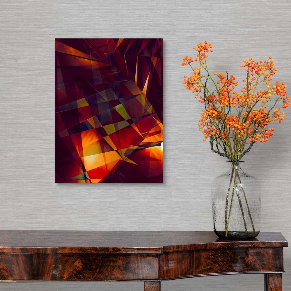 A traditional room featuring Abstract photograph made of intersecting angles and lines in varying fiery shades.