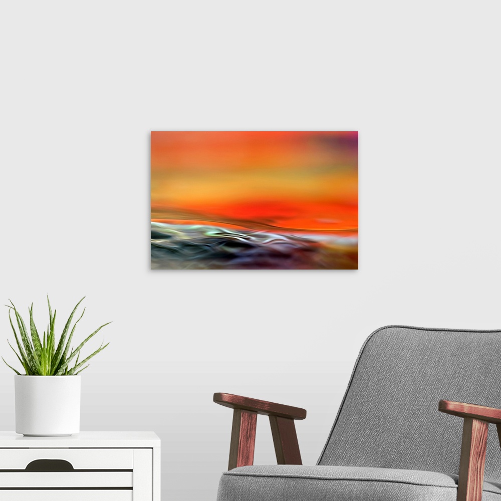 A modern room featuring Big, horizontal fine art photograph of waving, multi-colored water at the bottom of the image.  A...