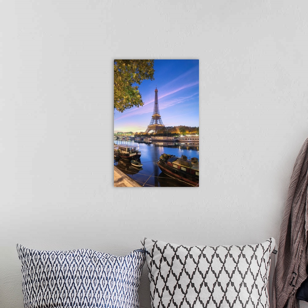 A bohemian room featuring Morning summer first lights on the Eiffel tower in Paris, France. Some boats and trees facing the...