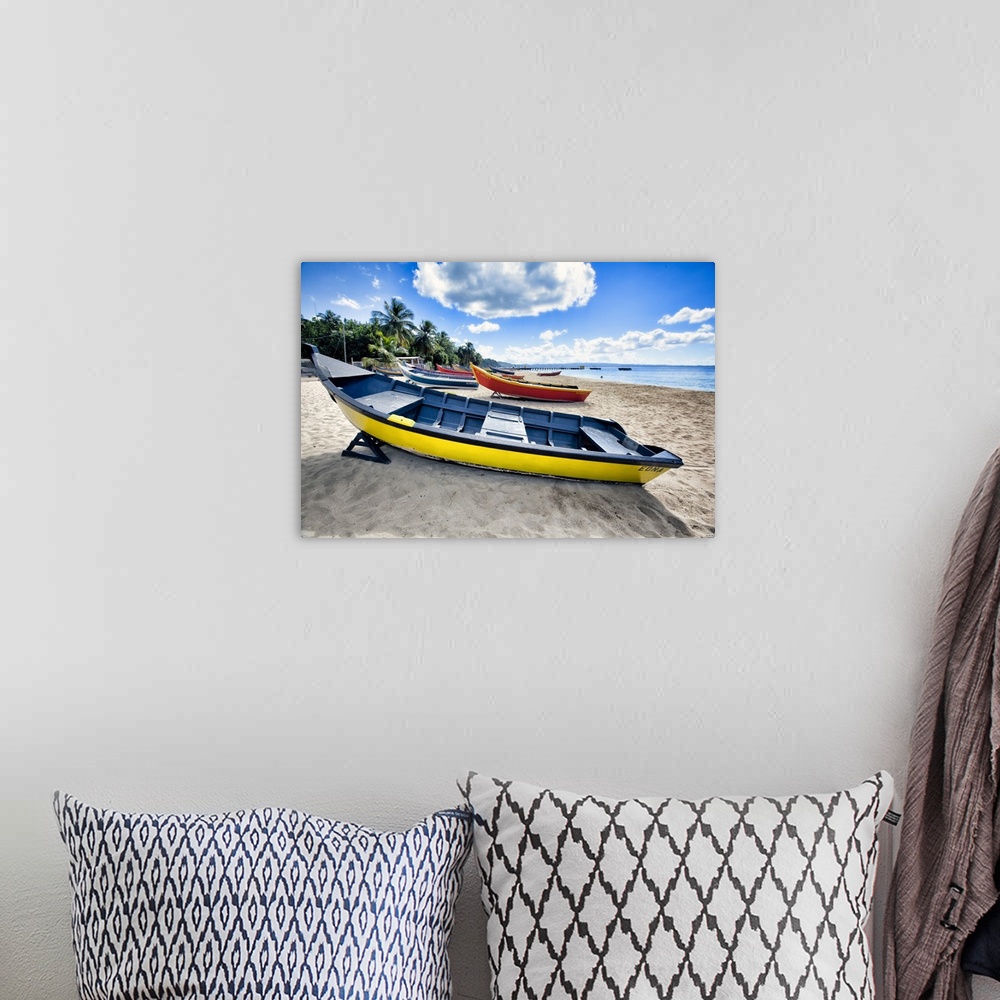 A bohemian room featuring Low angle view of colorful, small wooden, fishing boats on a Caribbean beach, Crash Boat Beach, A...