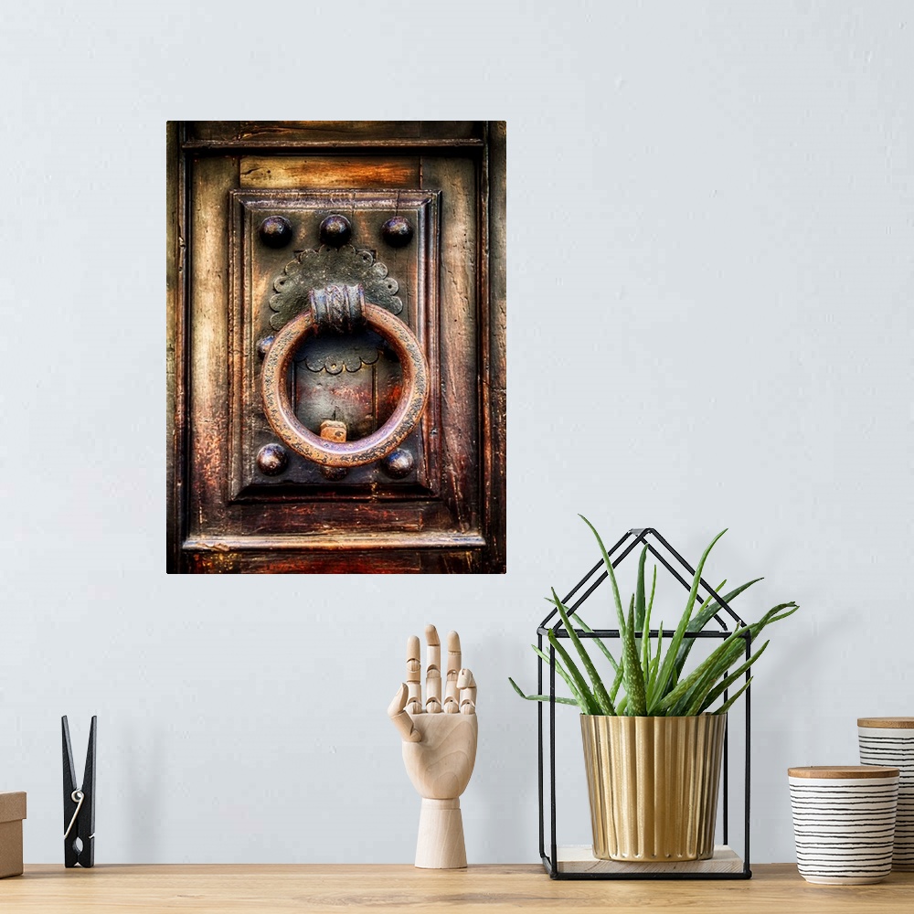 A bohemian room featuring Close Up View of an Antique Renaissance  Door Knocker, Florence, Tuscany, Italy.