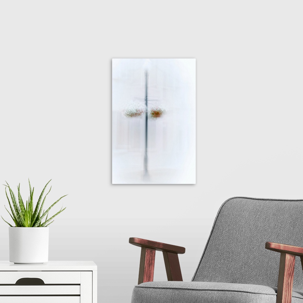 A modern room featuring Conceptual image of two hanging flower baskets on a post, obscured by hazy white light.