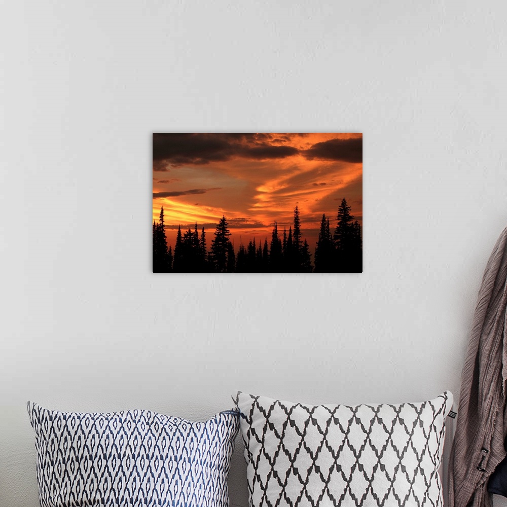 A bohemian room featuring The sky glows orange and gold from Miner's Ridge at sunset. North Cascades, Washington.