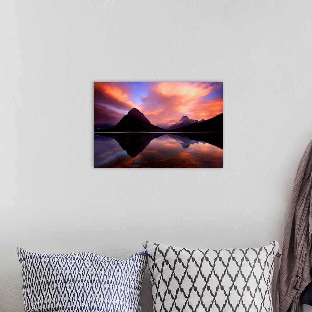 A bohemian room featuring Stunning photo of the sunset over the mountains and water at Glacier National Park in Montana.