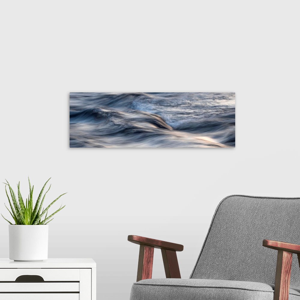 A modern room featuring Photograph of blurred motion waves of water rustling.