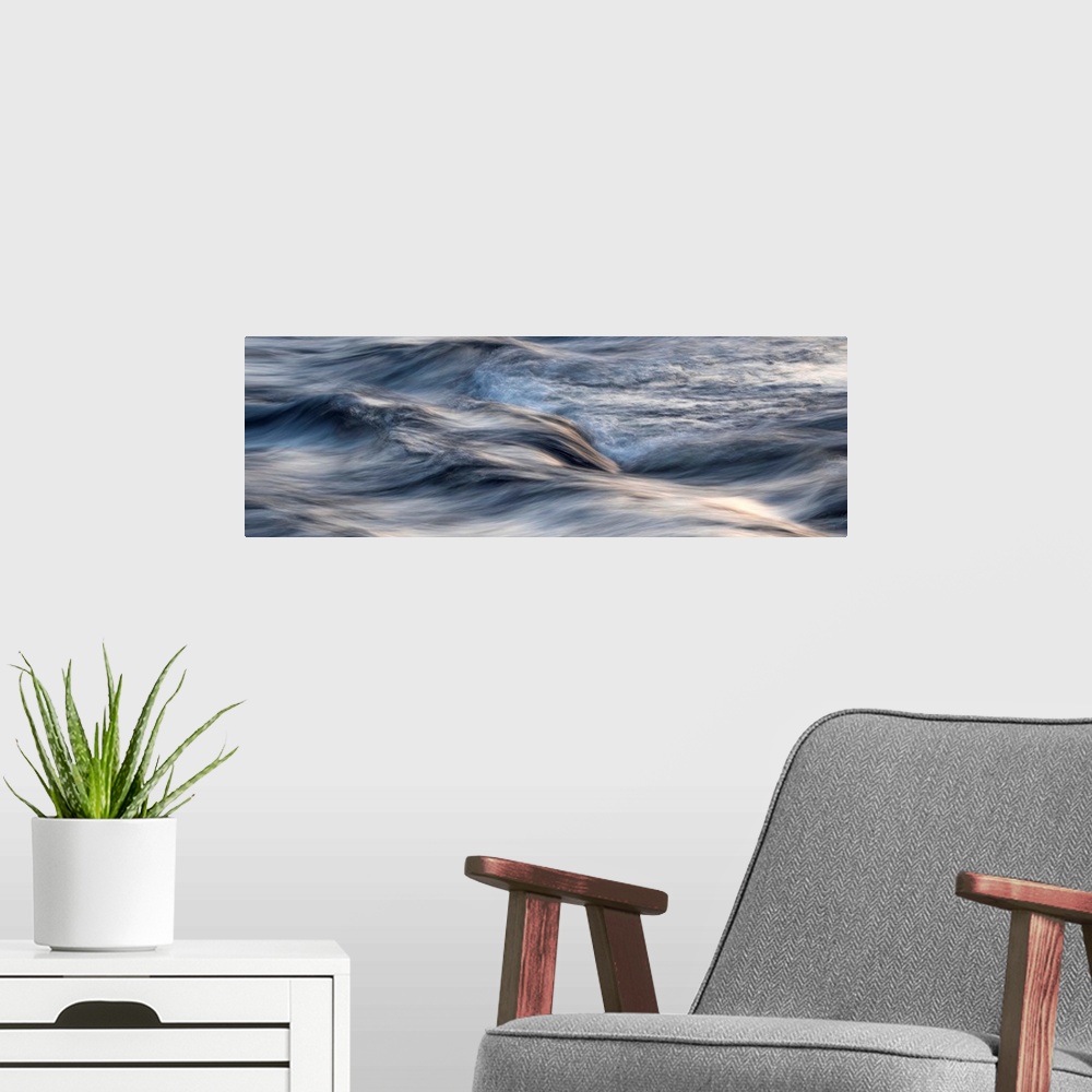 A modern room featuring Photograph of blurred motion waves of water rustling.