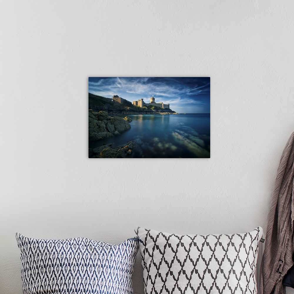 A bohemian room featuring Classical view of a castle facing the sea and the rock, the place of Fort la Latte, in Brittany i...