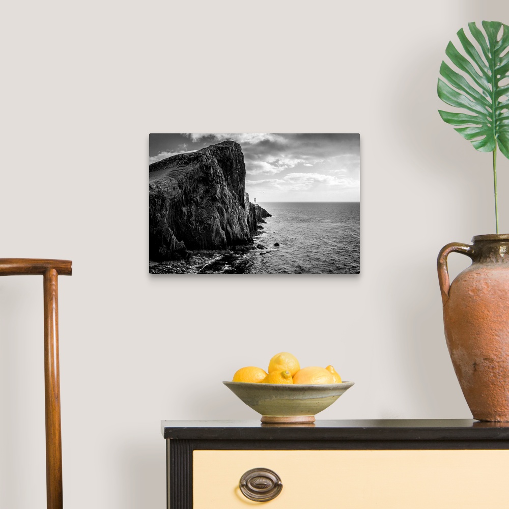 A traditional room featuring Fine art photo of a rocky cliff overlooking the ocean.