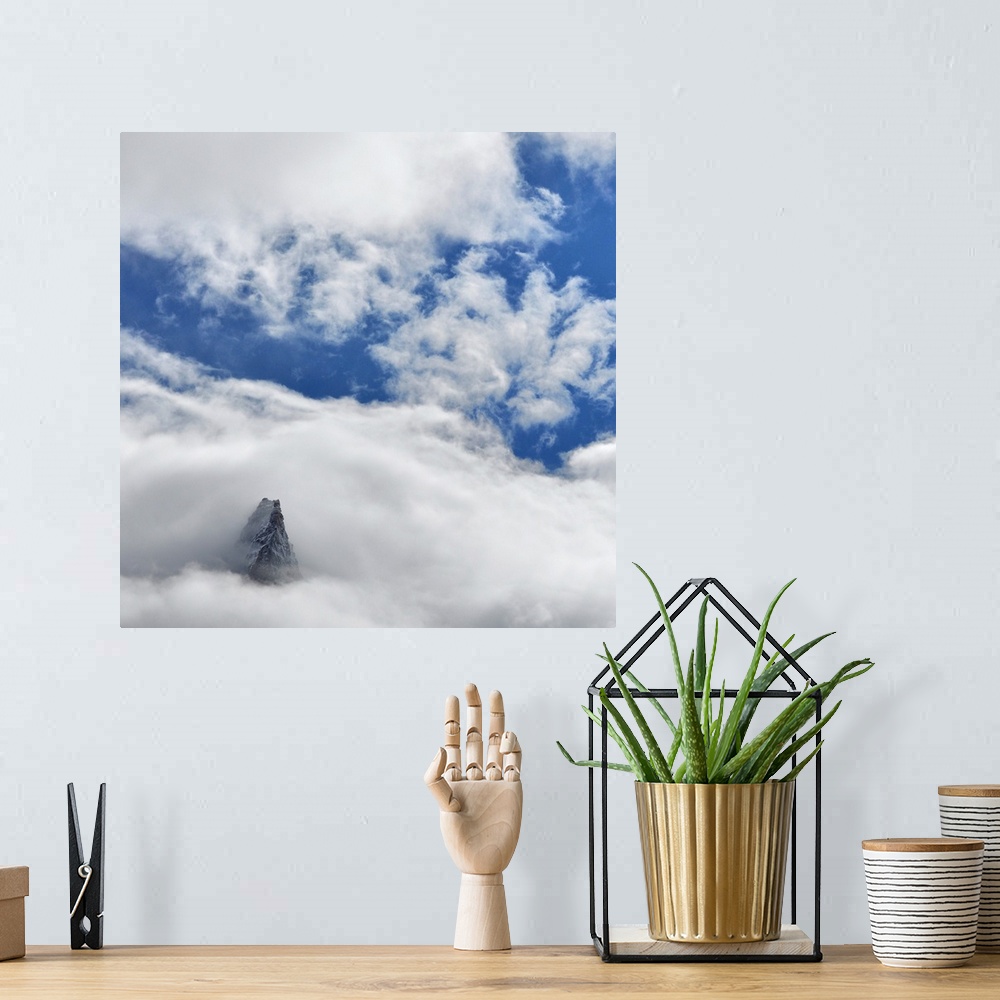 A bohemian room featuring French mountain, Aiguille des Dru, crossing the blue sky in the valley of Chamonix in French Alpes.