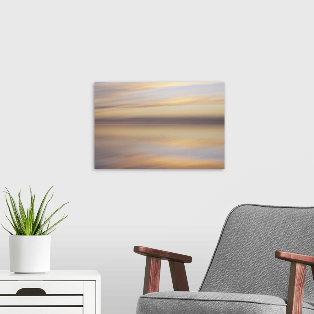 A modern room featuring Artistically blurred photo. Sunlit clouds are flirting with their reflection in the water of a lake.