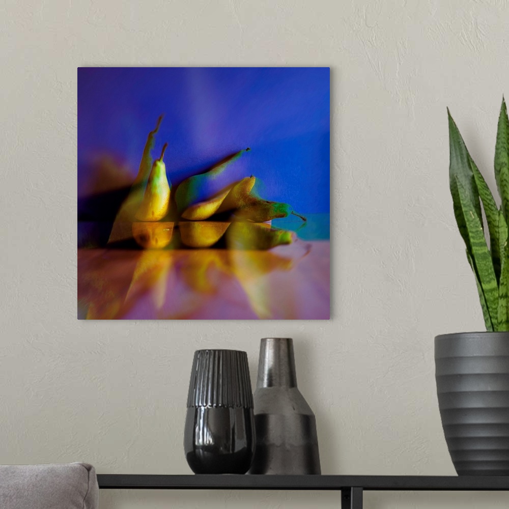 A modern room featuring Square photograph of pears on a blue and pink background with an abstract feel.