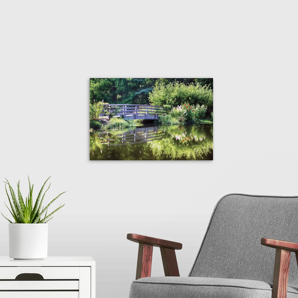 A modern room featuring Garden Pond with a Footbridge and Flowers, Far Hills, New Jersey