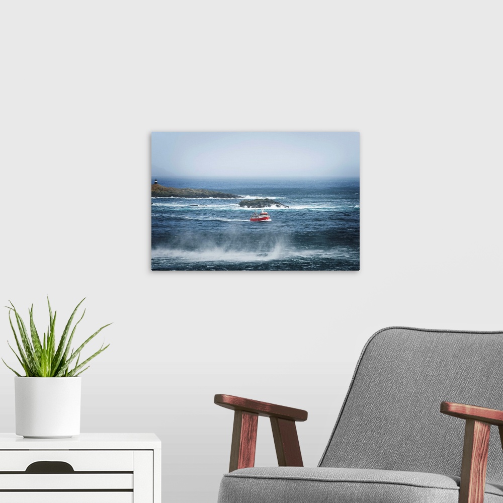 A modern room featuring Red fishing boat heading out to sea.