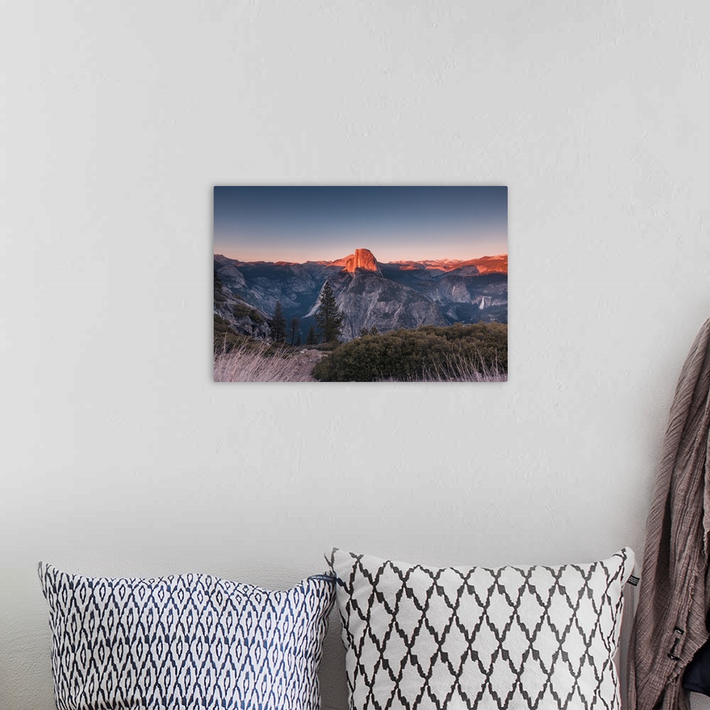 A bohemian room featuring Half Dome in golden color during sunset at Glacier Point, Yosemite National Park, California.