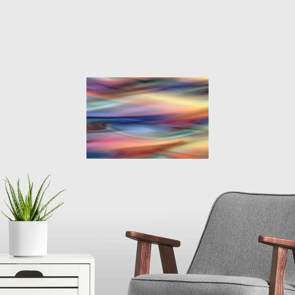 A modern room featuring Abstract artwork of flowing colorful tones that have been blended to create subtle ripples.
