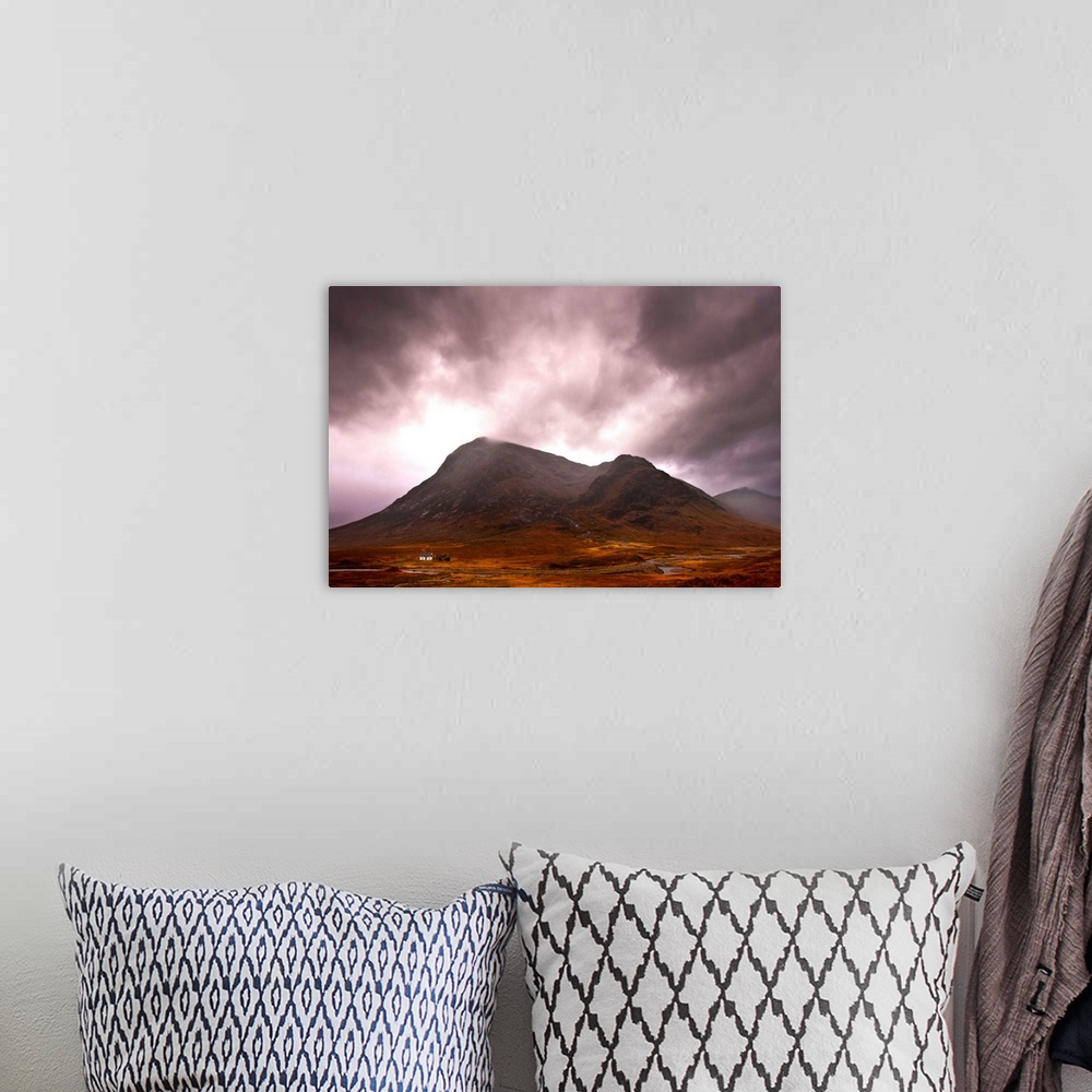 A bohemian room featuring A majestic Scottish mountain in Glencoe with dramatic storm clouds and rich autumn colours with a...