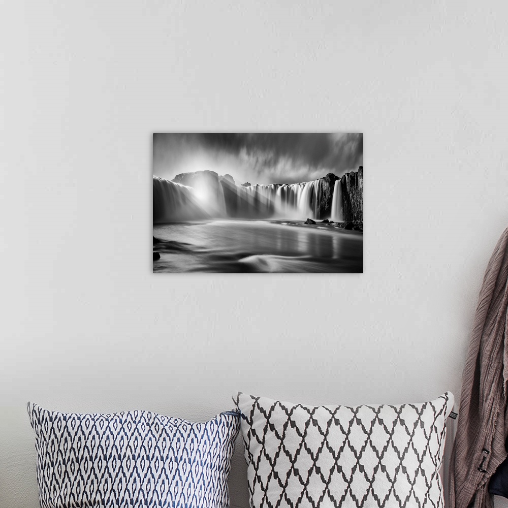 A bohemian room featuring Fine art photograph of sunlight shining over the waterfalls in Iceland.