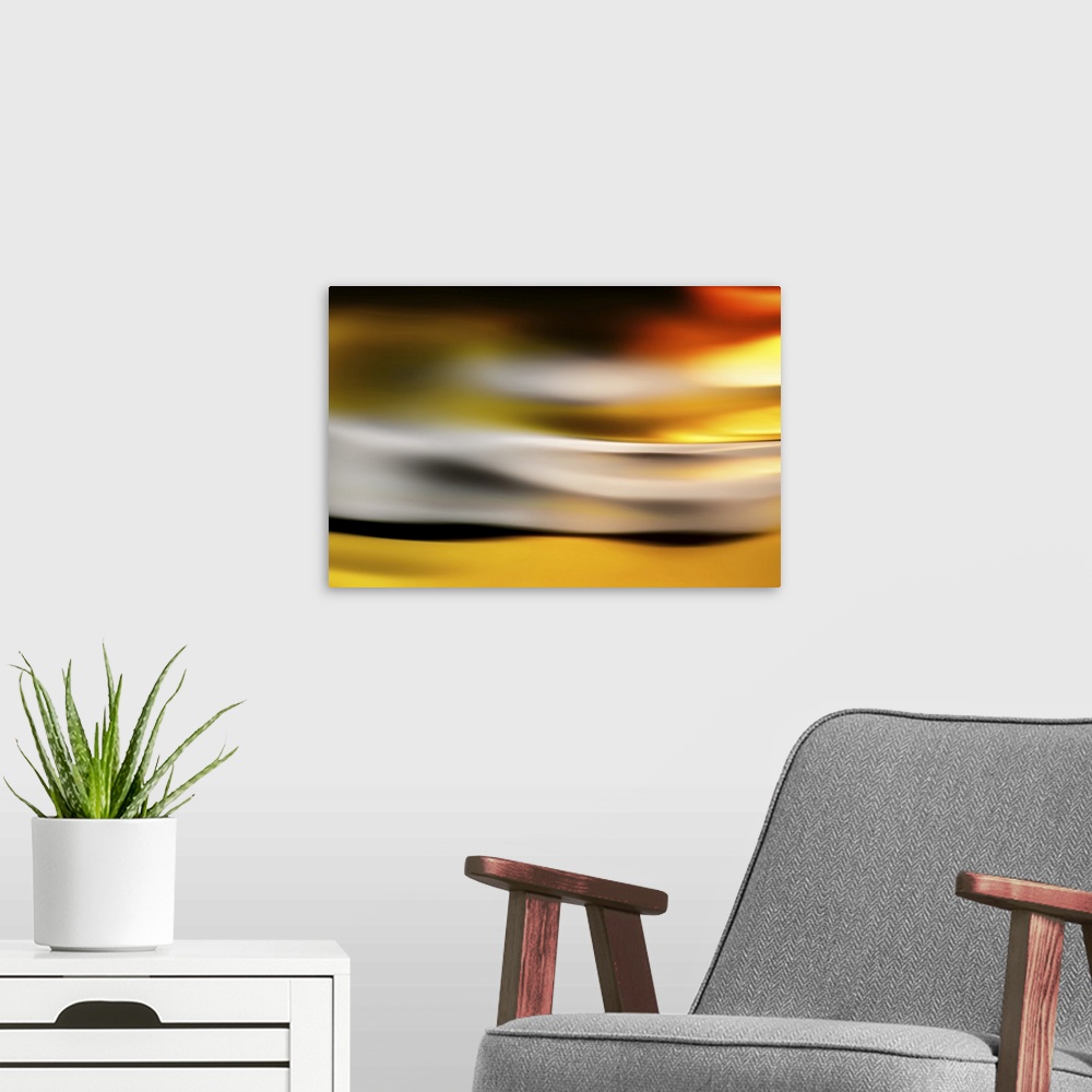 A modern room featuring Abstract image of a golden glow at sunset.