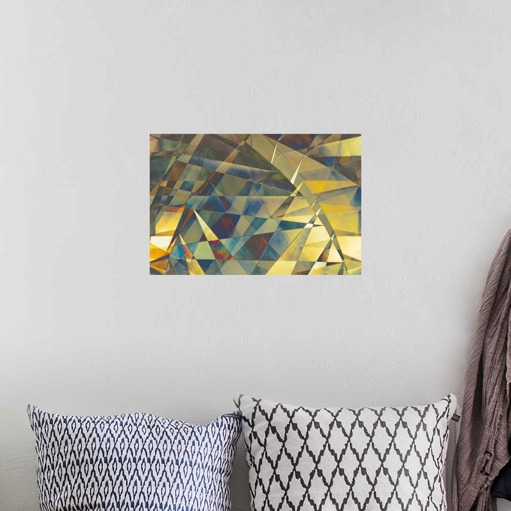 A bohemian room featuring Colorful geometric abstract photograph with blue, yellow, green, and purple hues.