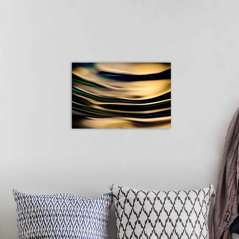 A bohemian room featuring Abstract photograph of rippling water up close with gold reflections and hints of blue, green, an...