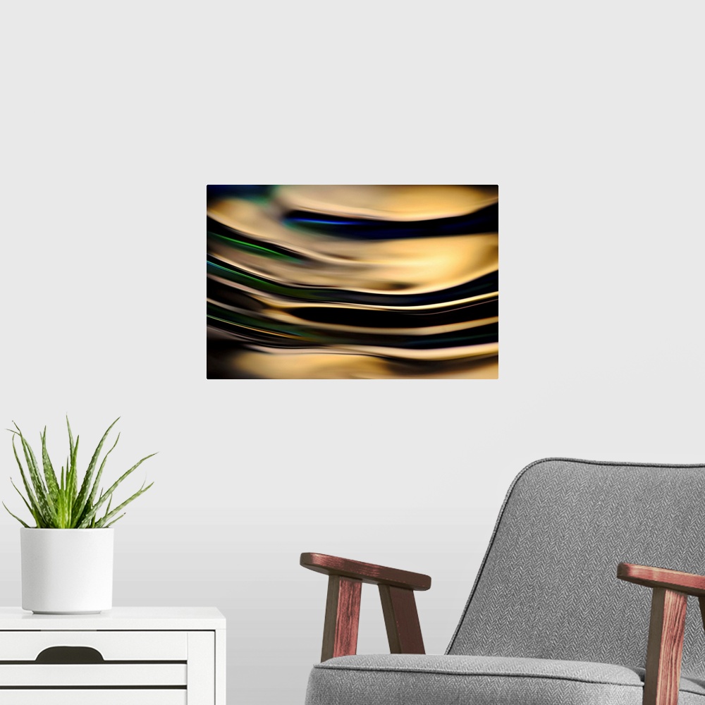 A modern room featuring Abstract photograph of rippling water up close with gold reflections and hints of blue, green, an...