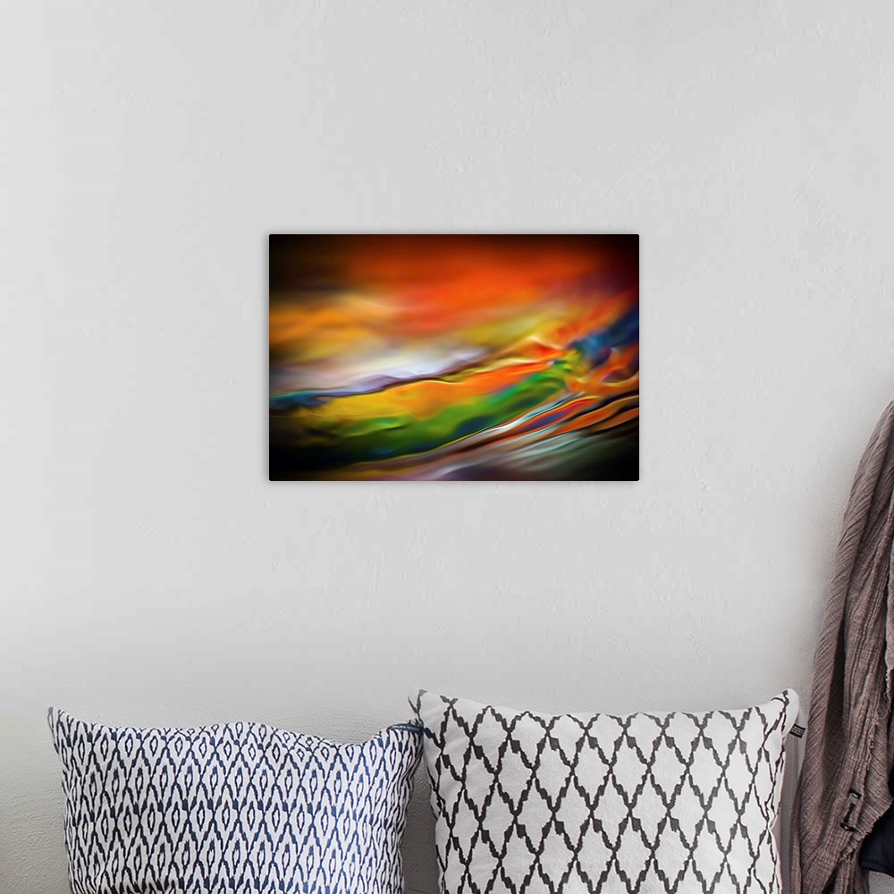 A bohemian room featuring Abstract art with colorful waves of color running horizontally and going towards the top across t...